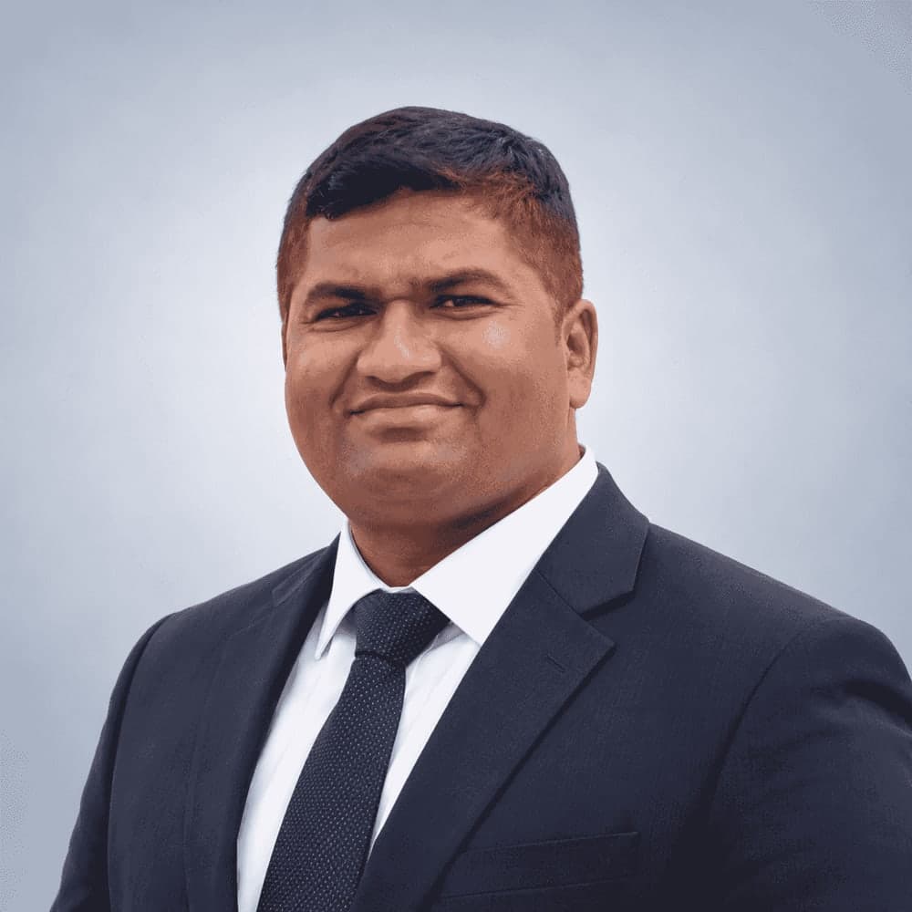 Rahul Gaikwad, Director of SSD Pest Control Services Pvt. Ltd., in a navy suit, white shirt and dark tie
